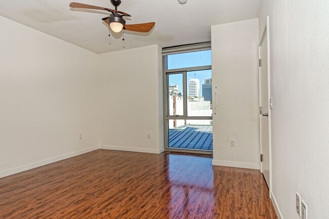 Building Photo - Modern Downtown Condo in Premier High-Rise...