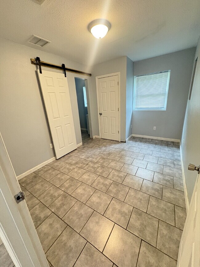 Building Photo - Open floor plan, four-bedroom two-bathroom with washer and dryer