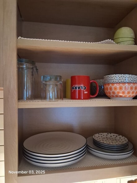 kitchen is furnished with plates, glasses, cups - 517 18th St