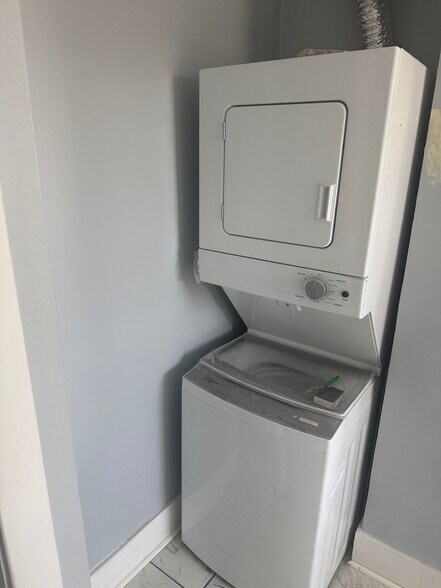 Kitchen includes a stackable washer and dryer - 304 Arthur Ave