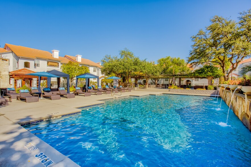 Glimmering pool area featuring soft-top cabanas - Windsor on White Rock Lake