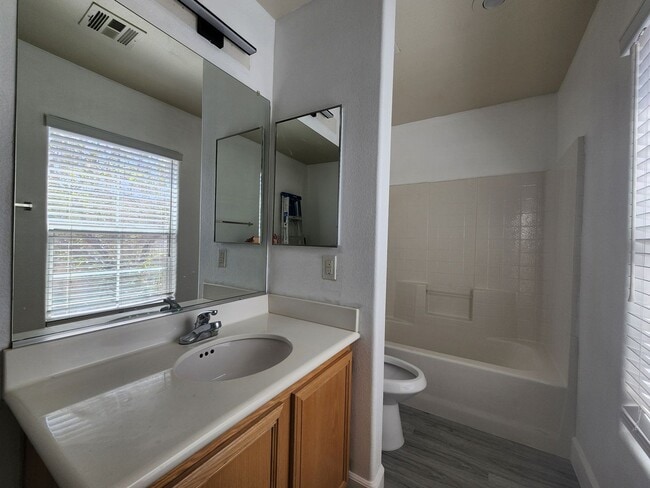 Building Photo - Sleek 2 story home with tile in most living areas and upgraded kitchen.