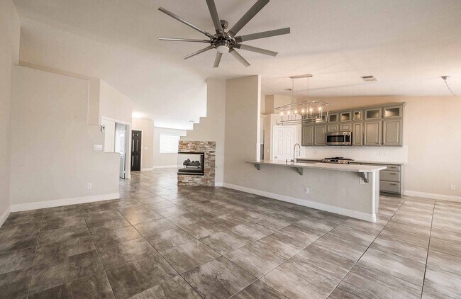 Building Photo - STUNNING 3 Bedroom Home with a 3 CAR GARAGE & RV PARKING!