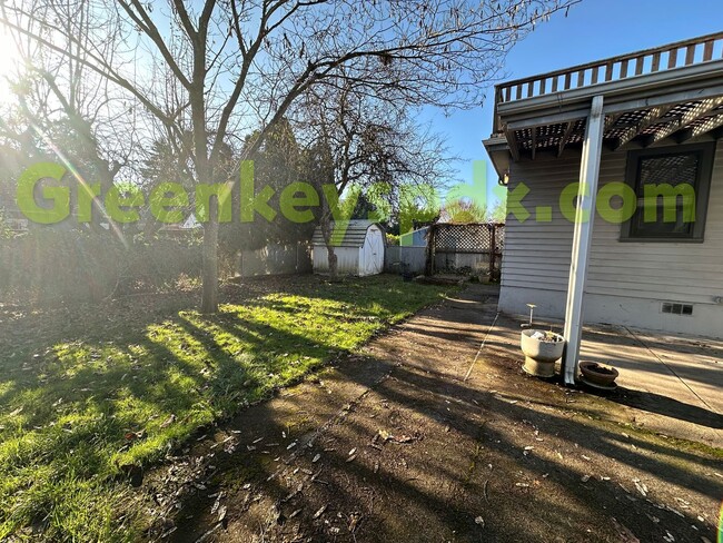 Building Photo - Huge, fenced back yard! Garage! Nice bonus...