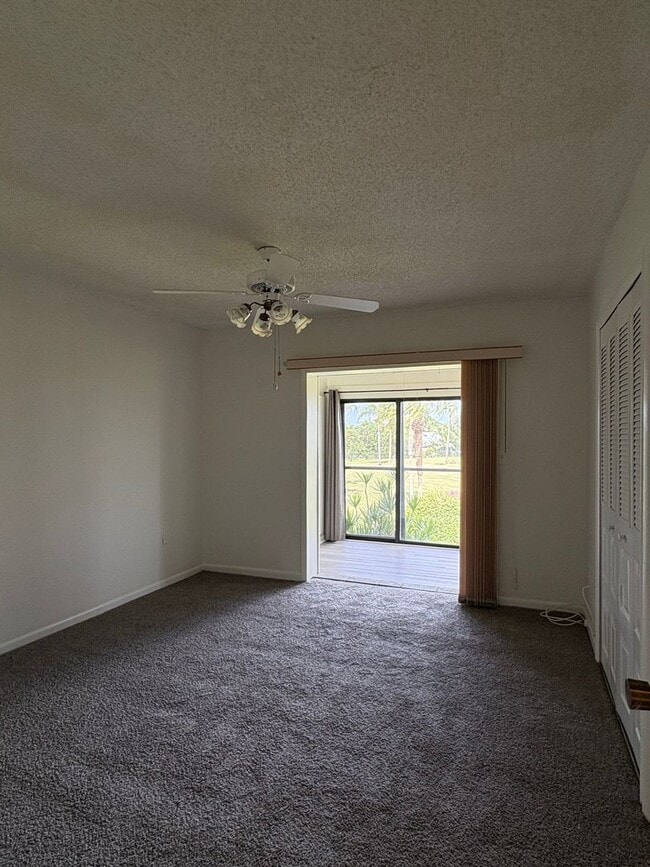 Building Photo - (55+) 2/2 Condo in the Peaceful Miles Grant Golf Course Community