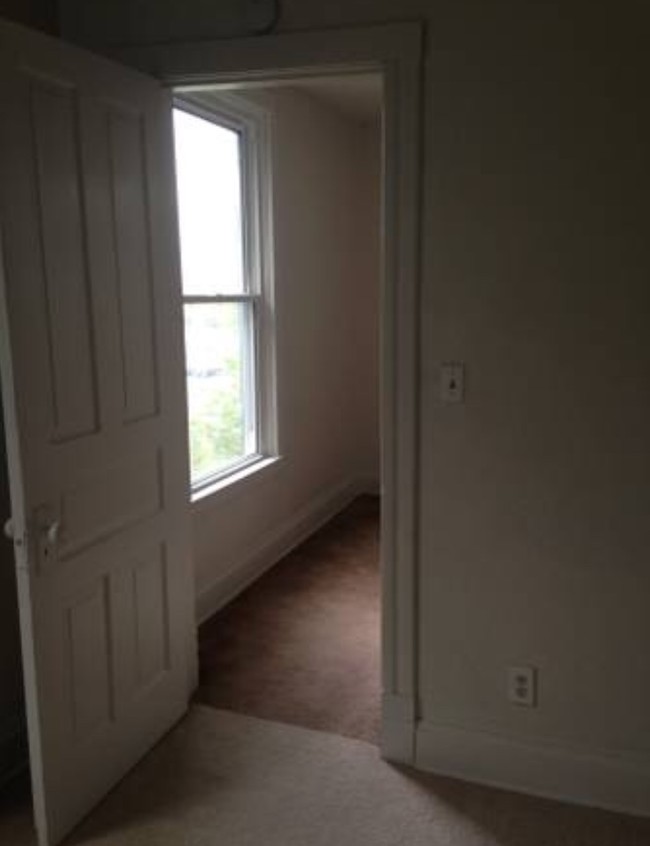 Bedroom on main floor looking into - 1205 E 4th St