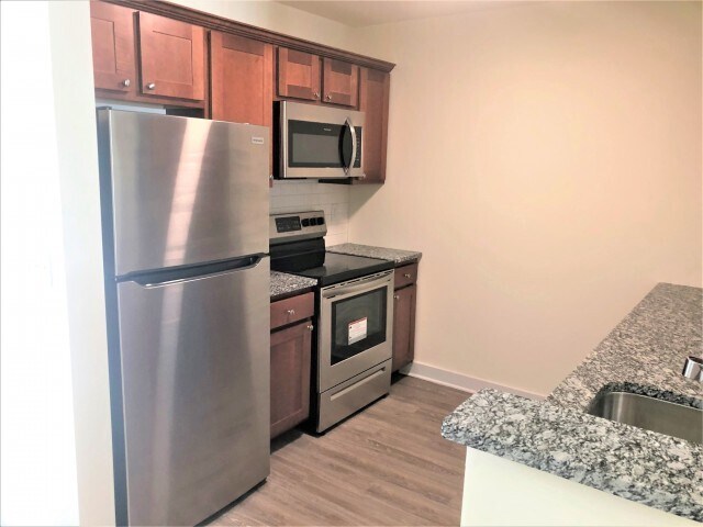 Your kitchen features beautiful granite countertops. - Sunrise Solars Apartments