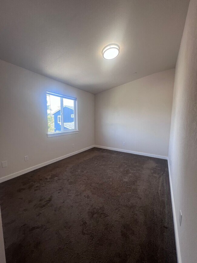 Building Photo - 2 Bedroom 1 bath house with extra large double car garage and extra storage space!