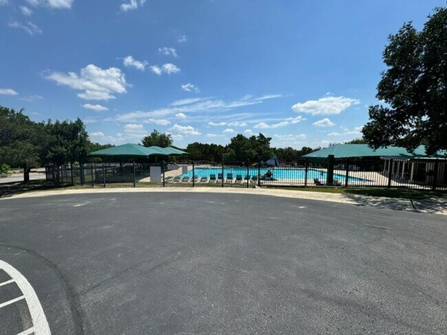 Building Photo - Ready For Move In! A Must See in Rogers Ranch - 4 Bedroom 2 Bath with Custom Features