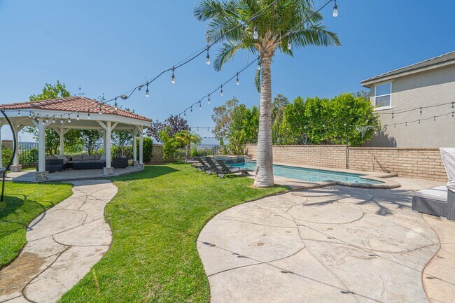 Building Photo - Spectacular 5-Bedroom Home with Pool, RV P...