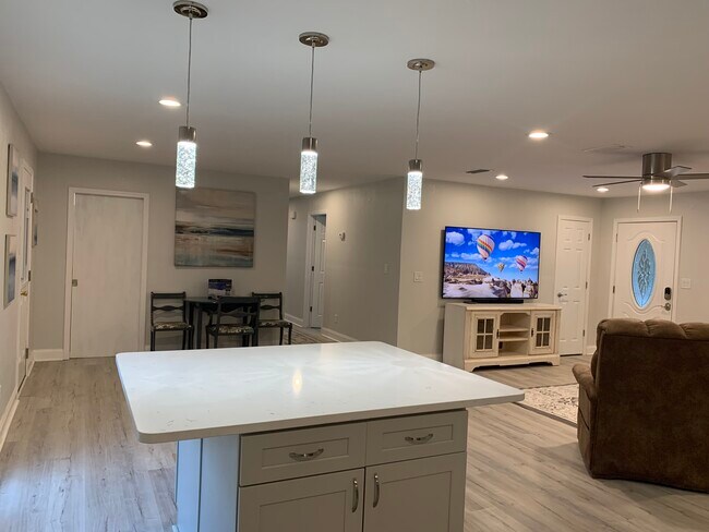 Spacious family area with 75'' HDTV and Soundbar - 1301 E Leonard St