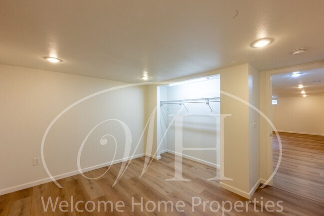 Building Photo - Spacious 5 Bedroom Home with Fenced Yard & Covered Parking