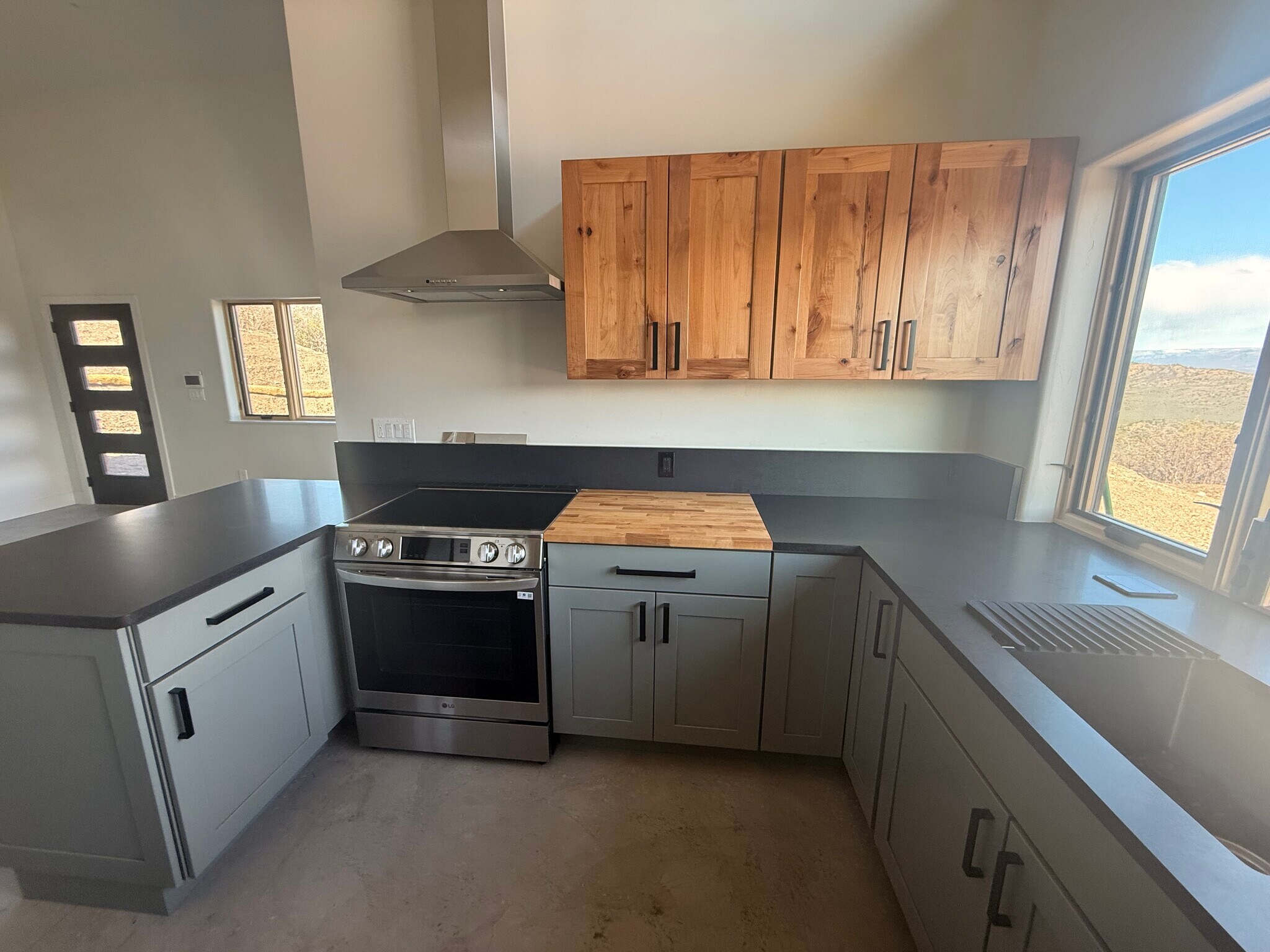 Custom cabinets, induction range, granite & butcher’s block countertops - 1905 Bear Ridge Rd