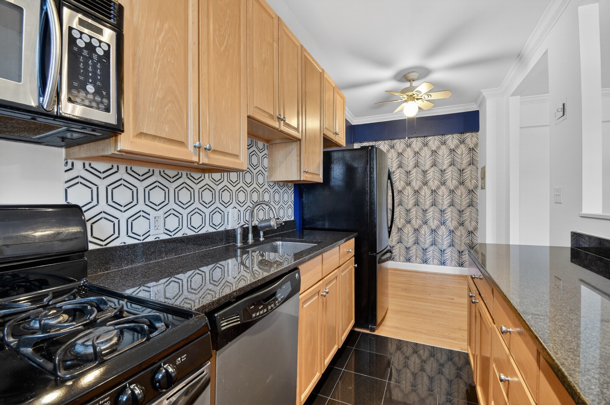 Updated kitchen with stainless steel countertops - 3925 Davis Pl NW