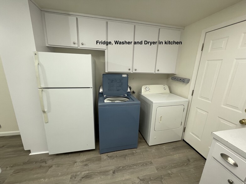 Fridge and washer/dryer in kitchen - 21585 Montgomery St