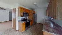 Building Photo - Two story duplex with two large bedrooms, walk in closet, one and a half bath, full basement.