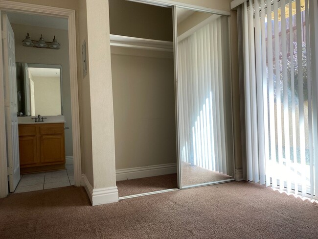 Building Photo - AFFORDABLE 1st Floor Condo & patio yard!