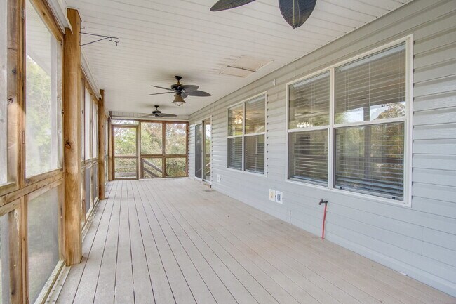 Building Photo - Live the Gulf Breeze Waterfront Life – Dock, Canal Access & Boat Lift!