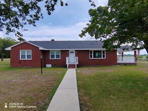 Building Photo - Charming 4-Bedroom Home for Rent – Peaceful & Nature-Filled Setting