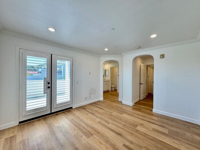 Building Photo - Beautifully Remodel Townhouse with AC & Two Car Garage!