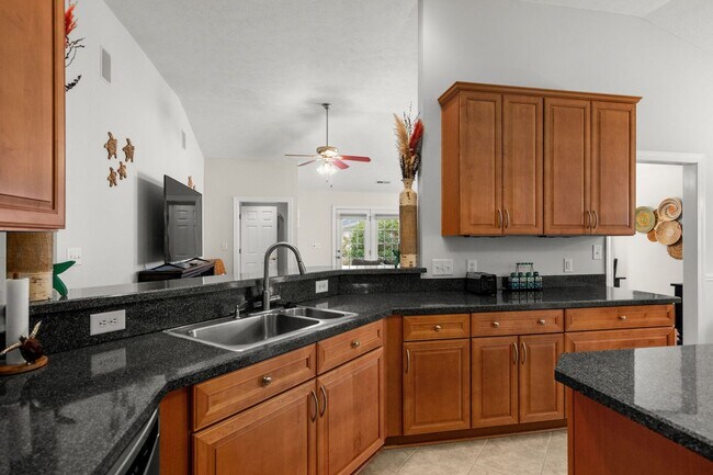 Building Photo - Live the Coastal Lifestyle in This Cypress Keys Beauty!