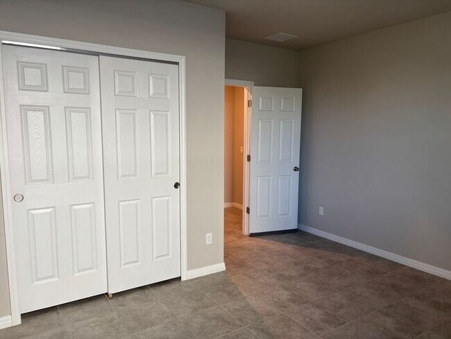 Building Photo - Like-New 4 Bedroom 3 Bath with Pond View & Two Living Spaces — Minutes to South Lake Nona
