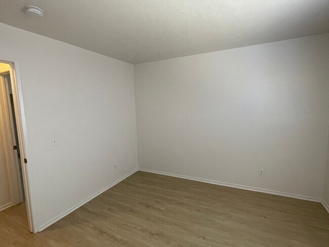 Building Photo - Adelanto Home-3 Bedrooms,2 Bathrooms, Laminate Floors, Indoor Laundry Room, Large Back Yard