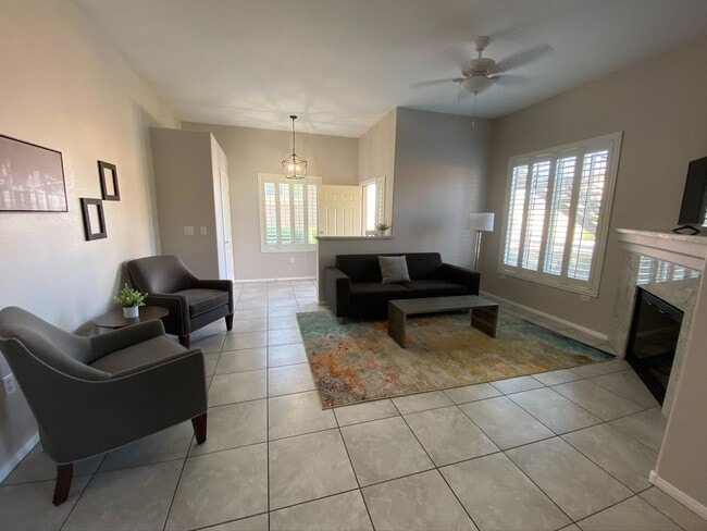 Building Photo - BEAUTIFUL CONDO IN A GATED COMMUNITY FEATURING PLANTATION SHUTTERS, TILE FLOORING AND NEW PAINT T...