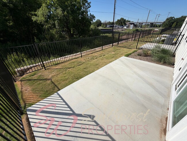 Building Photo - FOUR bedroom townhome. Can't get any closer to campus than this!