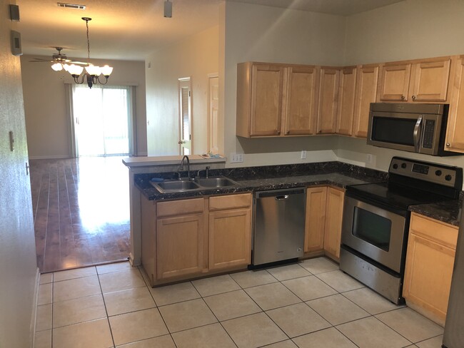 Kitchen with living area view. - 293 Scrub Jay Dr