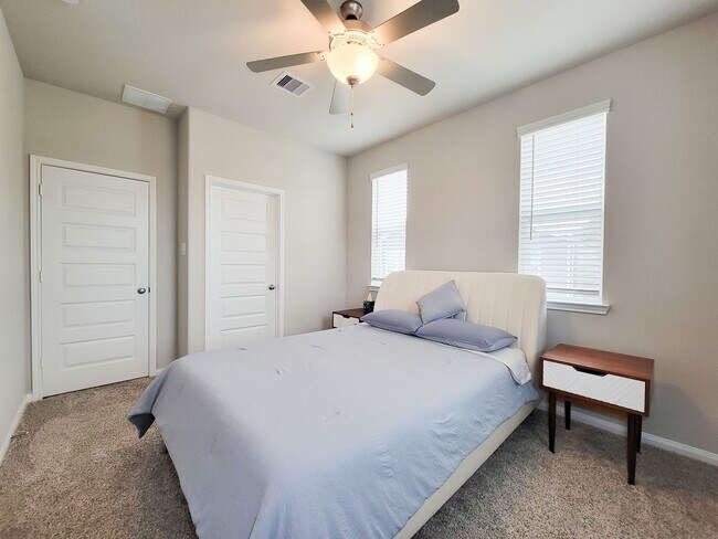 Building Photo - A true gem on a quiet corner lot, this spacious and sun-filled home is tucked away from street no...