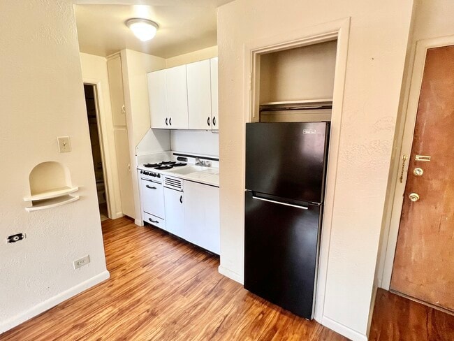 Step into a chic, urban kitchen designed for both style and functionality. - Hillside Apartments