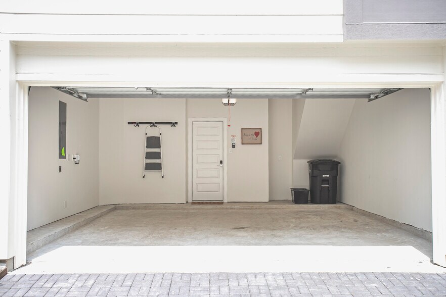 This 2 car garage has an EV charging station. - 2713 Eado Edge Ct
