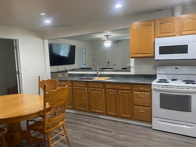 Kitchen showing stove and microwave - 6044 E Highway 20