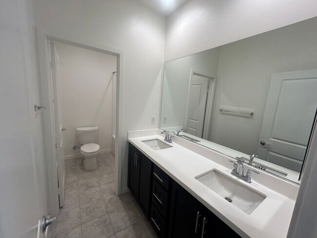 Building Photo - Modern 4 Bedroom Home with Downstairs Suite, Owned Solar & Resort-Style HOA Amenities