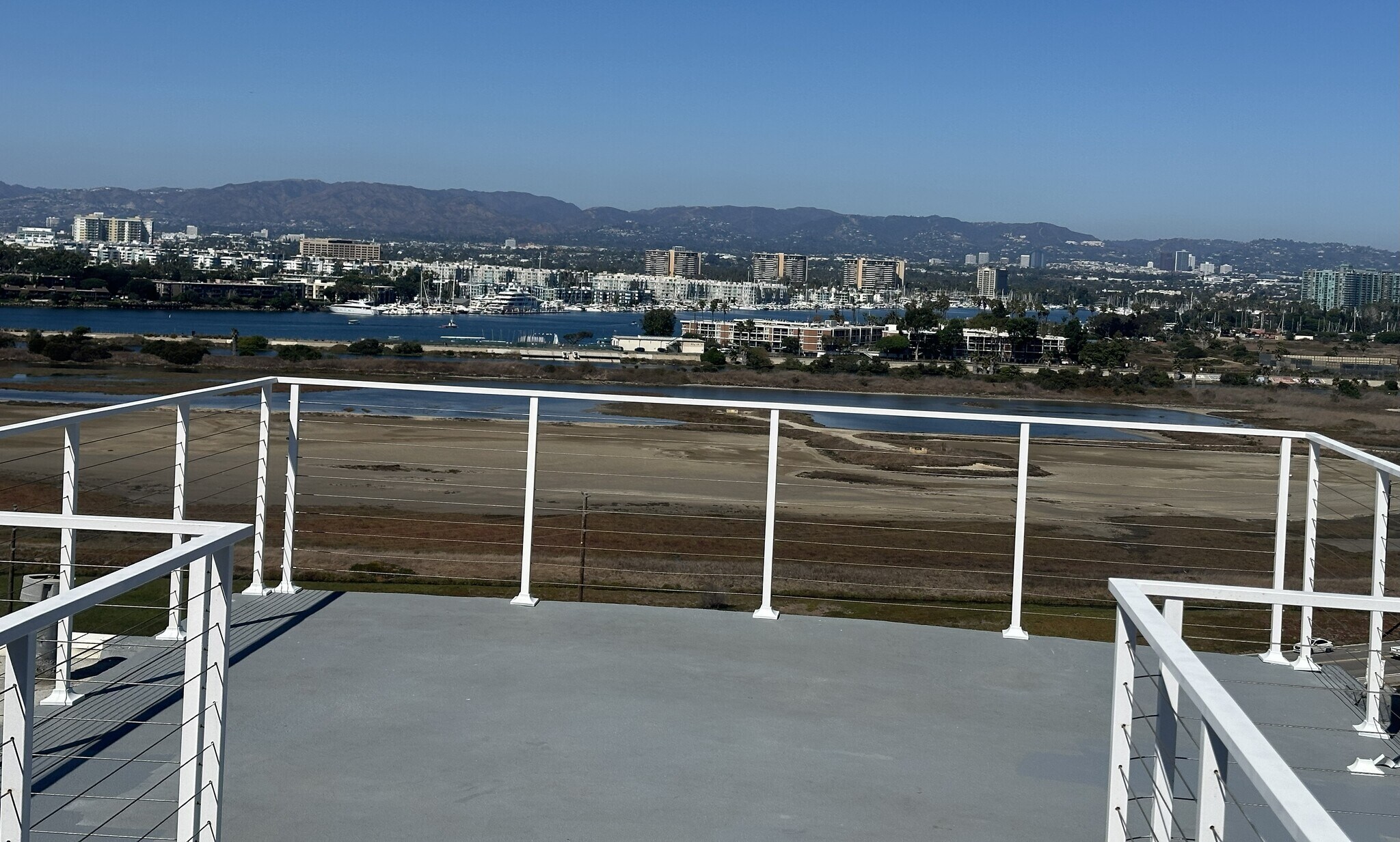 ?? Expansive rooftop deck offers sweeping views from marshland to skyline—an ideal setting - 8120 Billowvista Dr