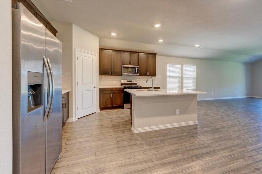Kitchen with stainless steel appliances - 1109 Birchwood Ln