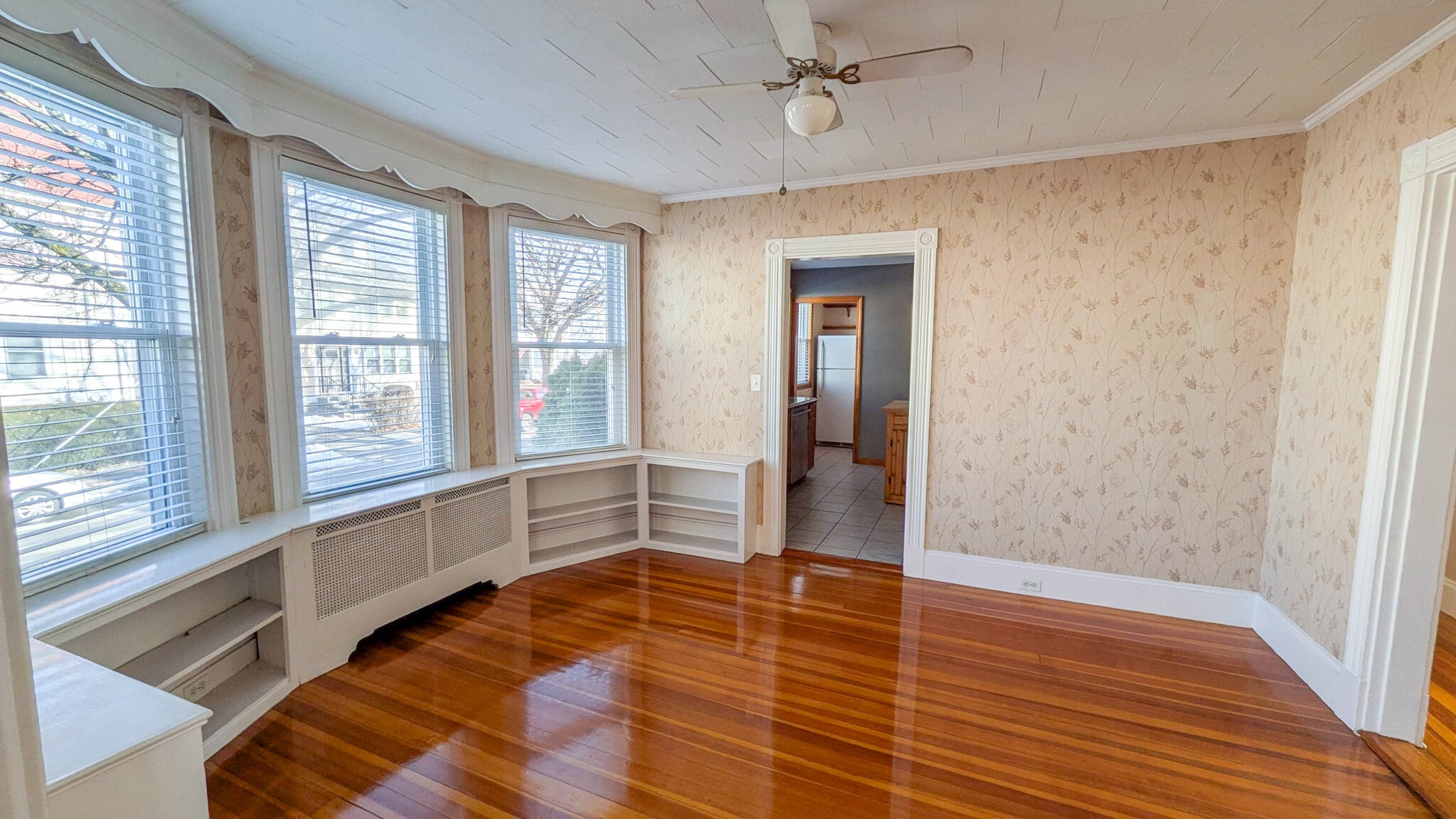 Spacious dining room with charming built-in bookshelves, offering flexibility for hosting or a dedic - 37 Glover Ave