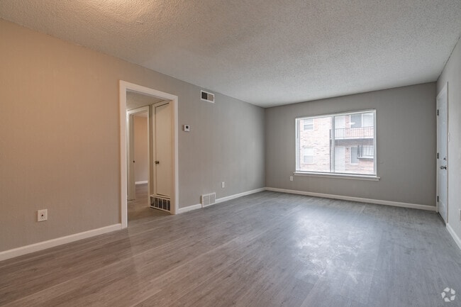 3BR, 2BA - 1100SF - Living Room - Camelot Manor