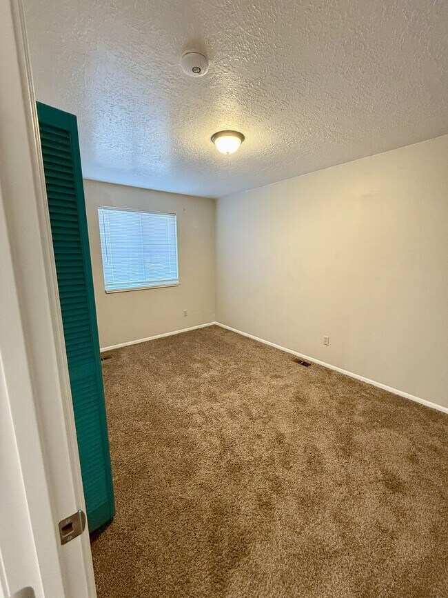 Building Photo - Spacious Comfort Meets Practical Living in...