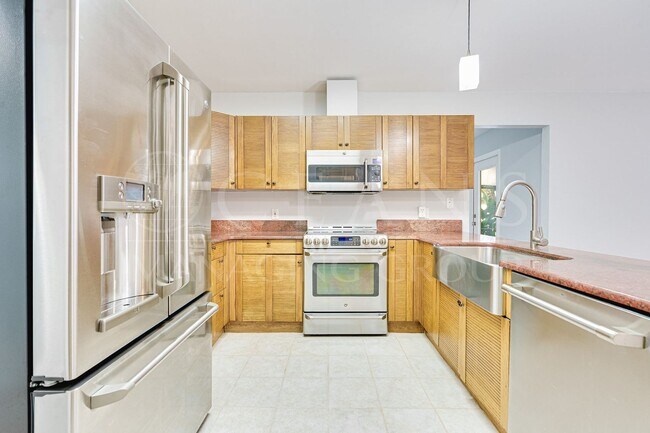 Building Photo - Executive Four-Bedroom Pool Home