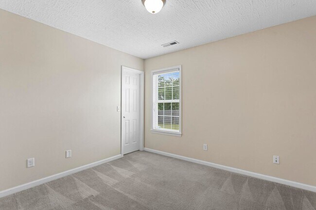 Building Photo - House with Fenced Back Yard Available!