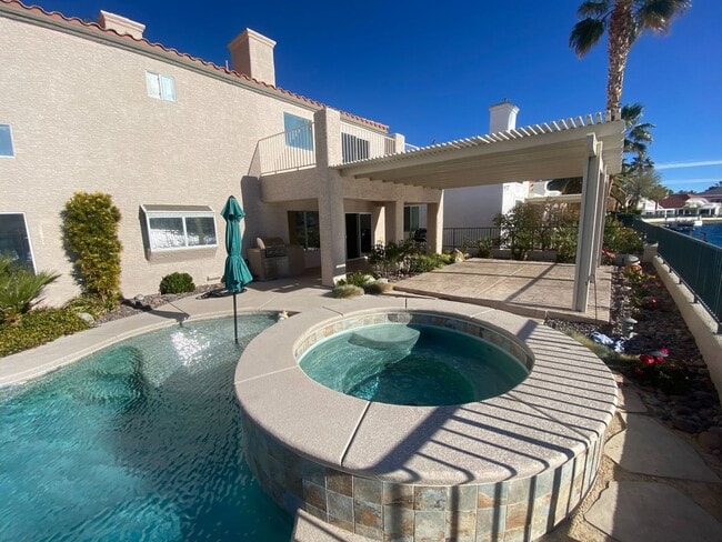 Building Photo - Luxury Lakefront Living in Desert Shores – 4 Bedroom Home with Private Dock & Stunning Views