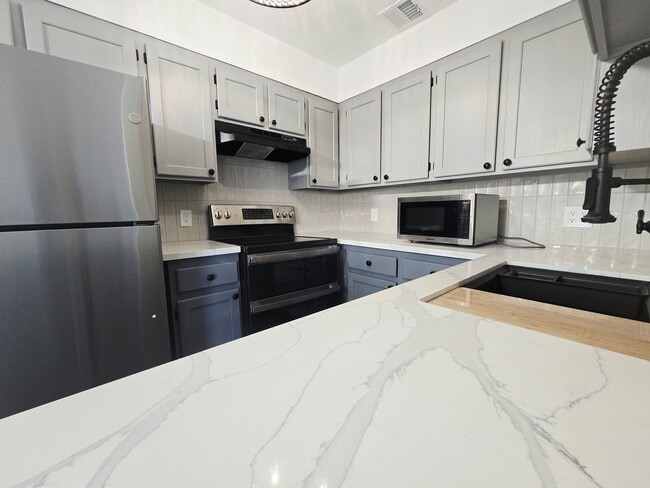 Building Photo - Stylish Green Valley Townhome – Upgraded 2 Bed 2 Bath with Private Garage & Covered Deck