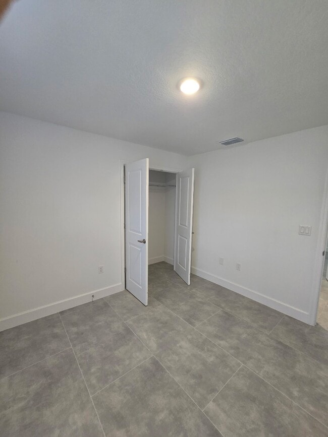 Building Photo - Brand-New 4-Bed Beauty with Attached Garage in Palm Bay – Modern Comfort, Prime Convenience!