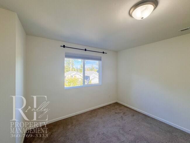 Building Photo - Spacious 3-Story Home with Flexible Living Space, Heat Pump & Private Deck Retreat