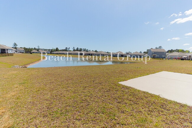 Building Photo - Spacious 4 Bedroom with Pond View