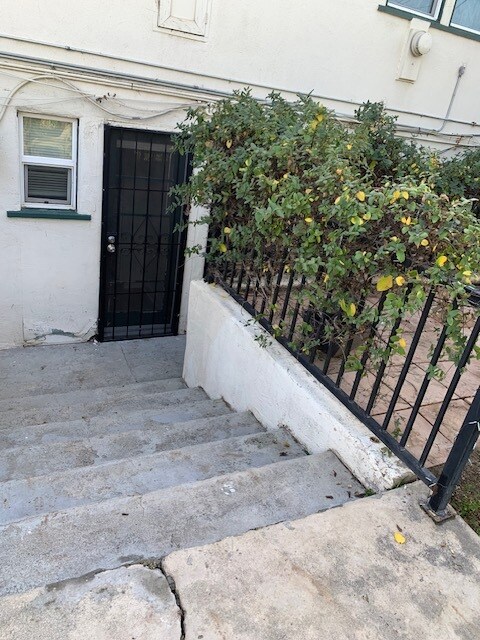 Steps down to front door. Laundry room is to the left of the kitchen door (not shown). - 24606 University Ave