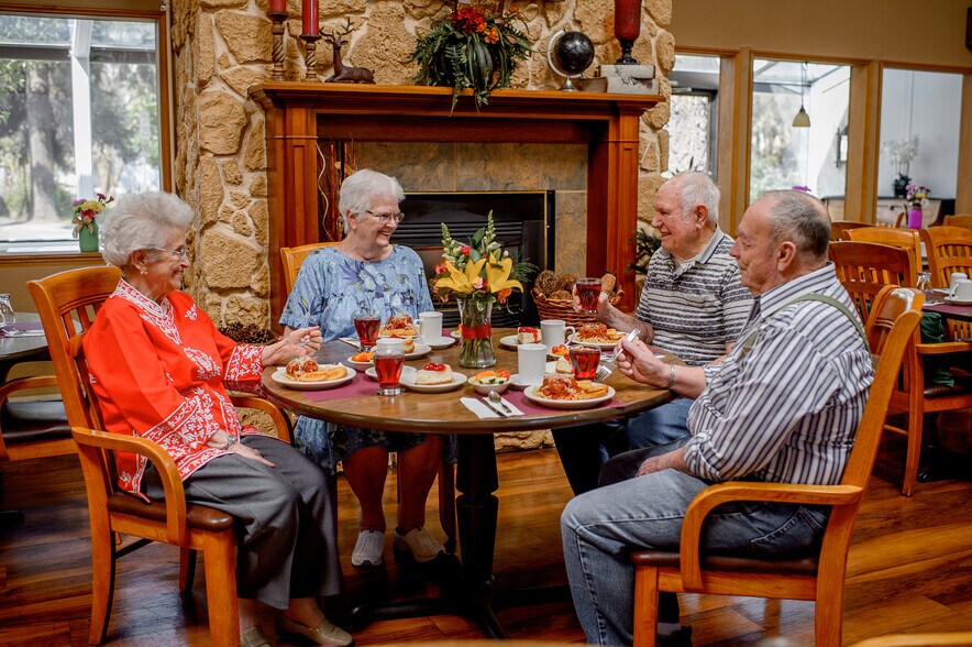 Beautiful Dining Room Complete w/ Fireplace - Bestland Senior Living All-Inclusive