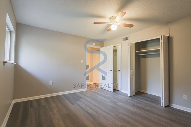 Building Photo - Move in before December 31st and choose your reward: a $250 Amazon Gift Card or a 55" Smart TV!